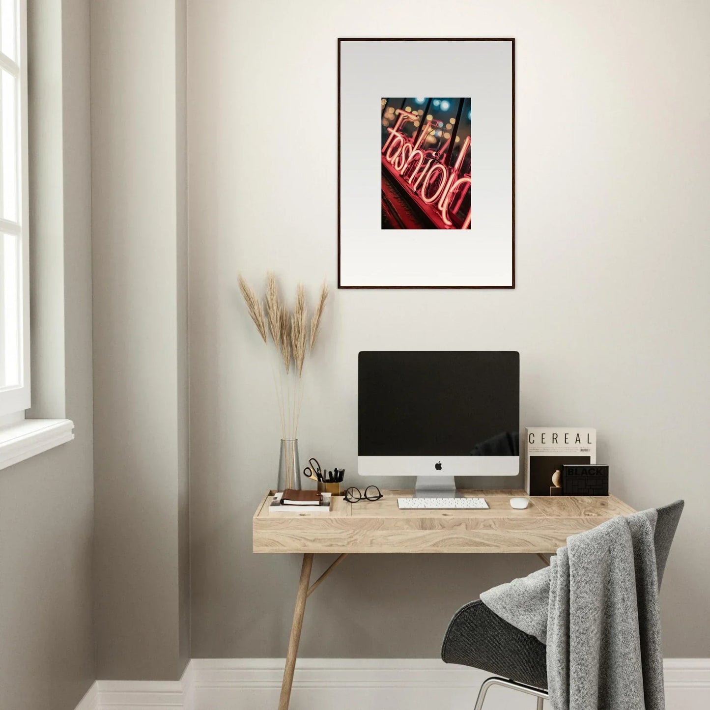 Minimalist home office with Tomido Lasid Quara desk, computer, and neon sign art