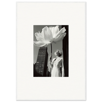 Black and white photograph of a person standing beneath an oversized flower sculpture.