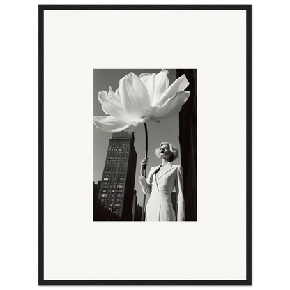 Woman holding an oversized flower against an urban backdrop.