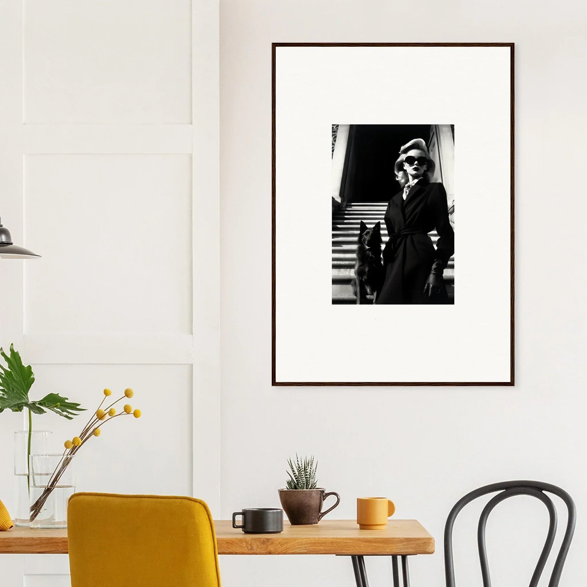 Framed black and white wall art of a person on stairs for stylish room decoration