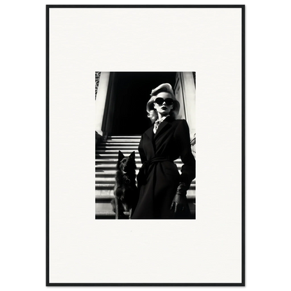 Black and white wall art of a woman in a dark coat with a dog on stairs