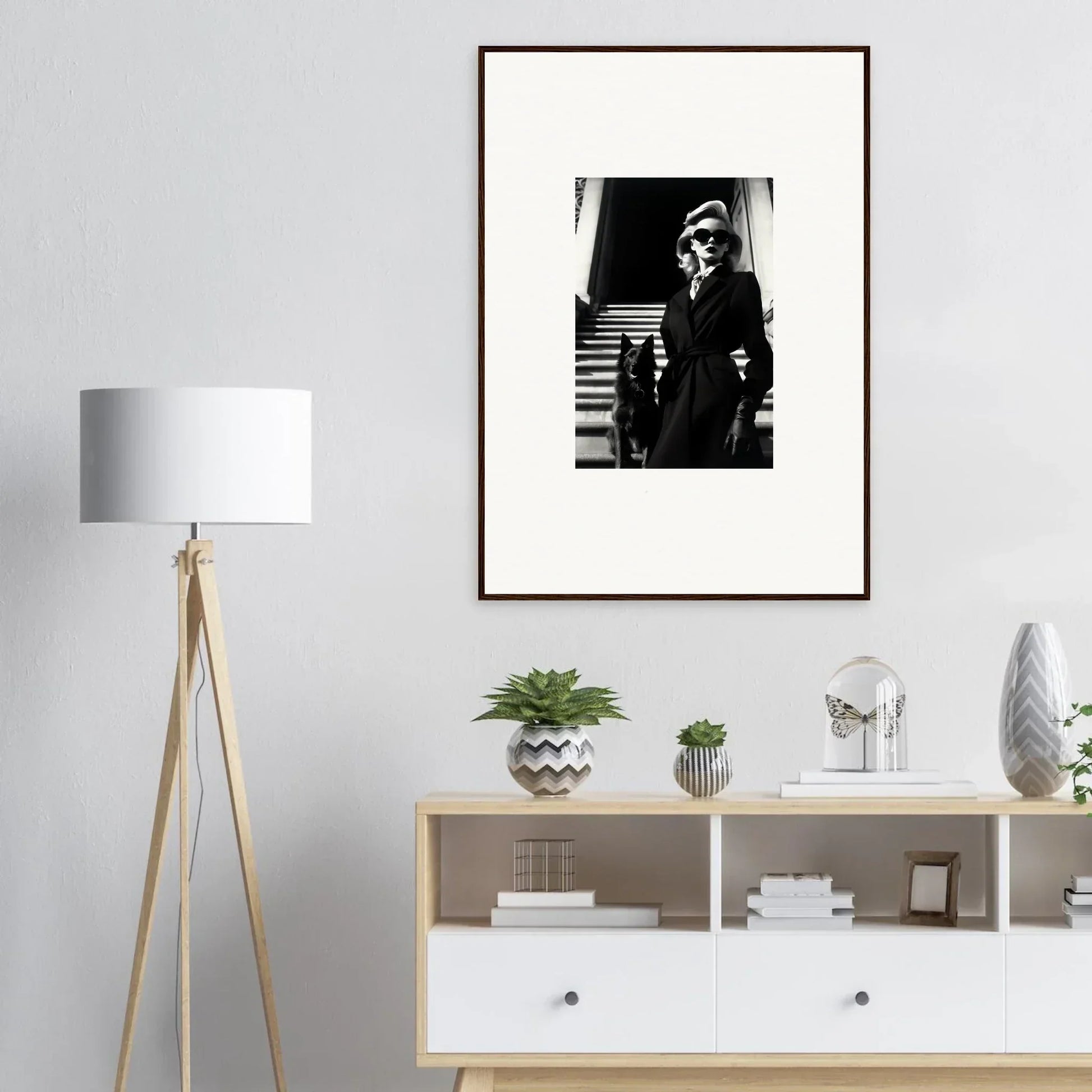 Framed black and white wall art of a vintage-dressed person on stairs for room decoration