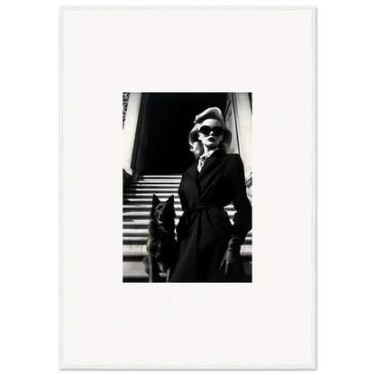 Black and white wall art of a woman in a dark coat with a dog on stairs