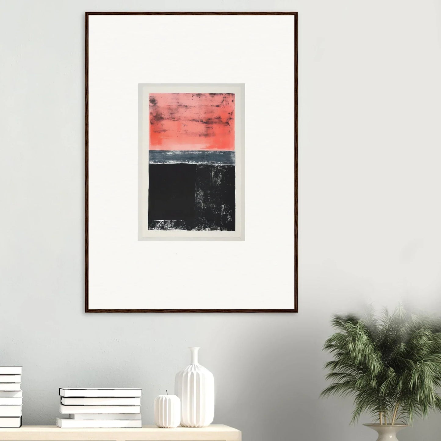 Framed wall art featuring an abstract red sky over a dark landscape, perfect for room decor