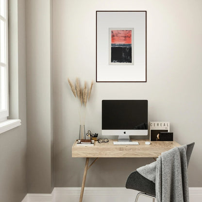 Minimalist wooden desk with computer monitor and framed wall art for isolation ritual room decor