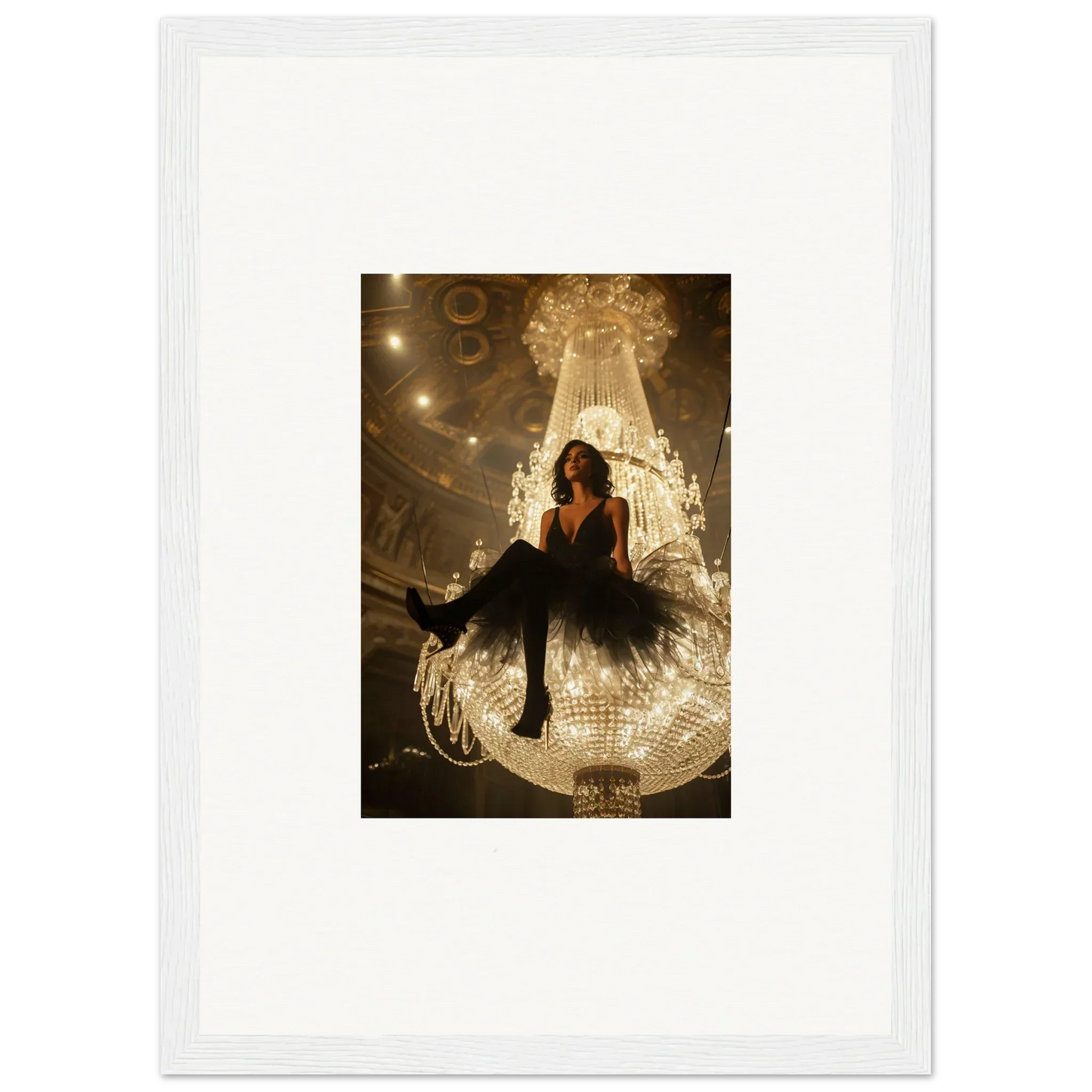 Woman in a black dress on a giant illuminated chandelier for Velvet Charset Angel room decoration