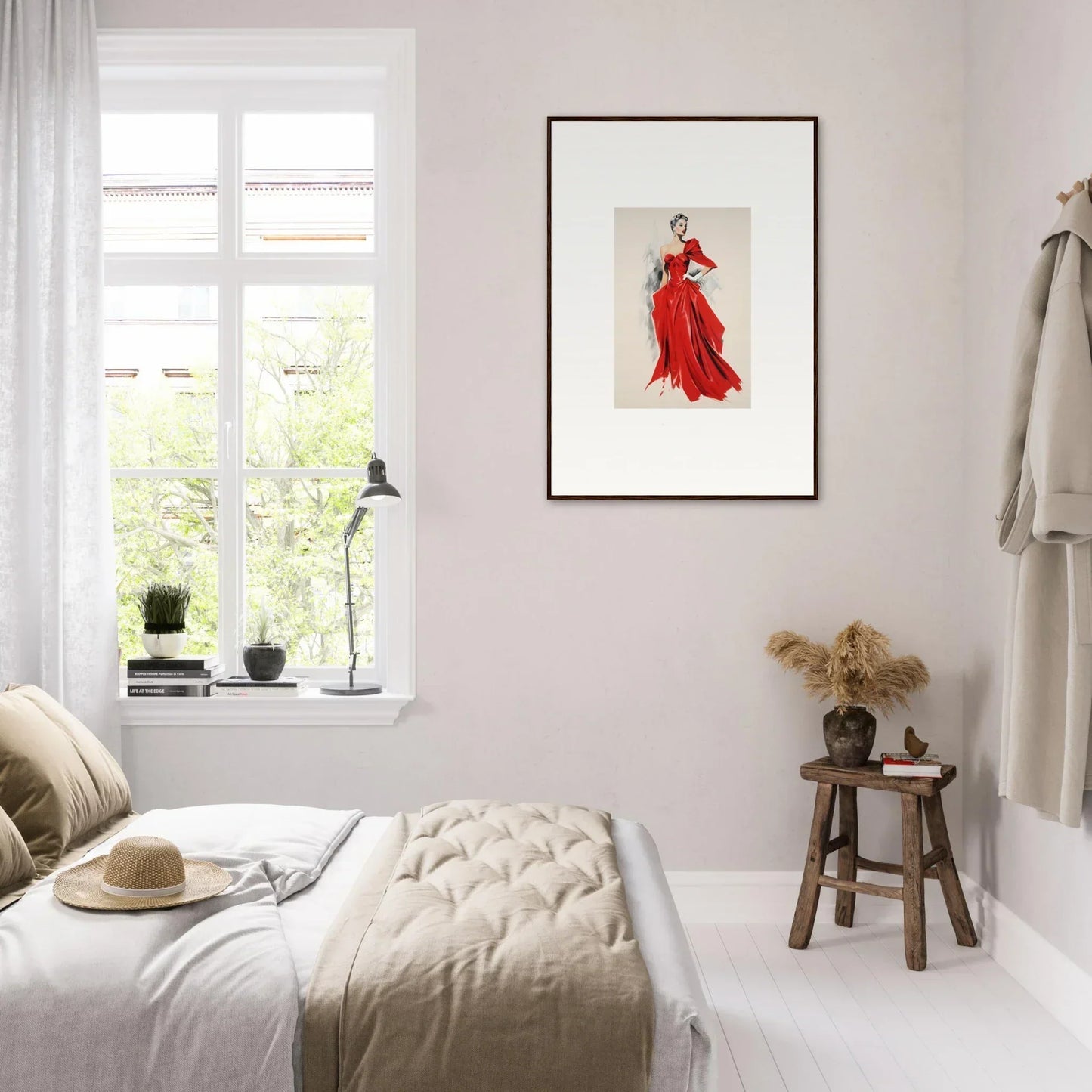 Bright bedroom with neutral tones and a Velvet Mirage framed red fashion illustration