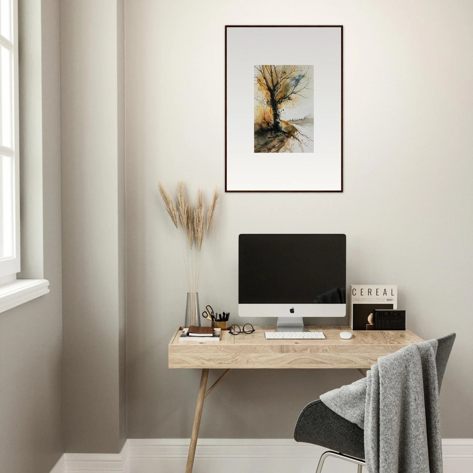 Minimalist wooden desk with a computer, framed wall art, perfect for room decoration