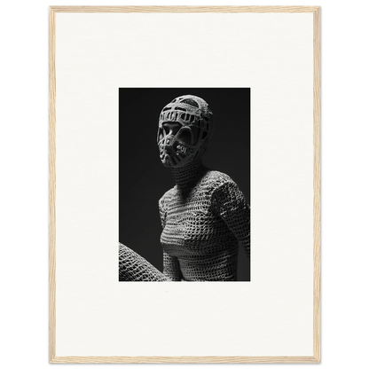 Black and white photograph of a bust wearing chainmail armor and a helmet.