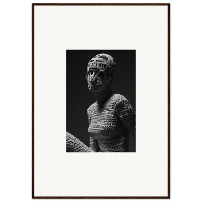 Black and white photograph of a figure wearing a knitted or crocheted bodysuit and headpiece.