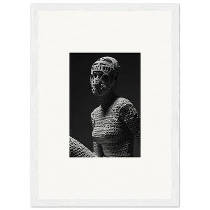 Black and white photograph of a figure wearing textured clothing and a head covering.