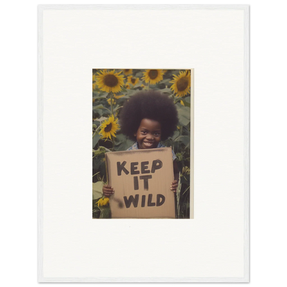 Framed photo of a person with a KEEP IT WILD sign among sunflowers in Visions Bloom Exuberance