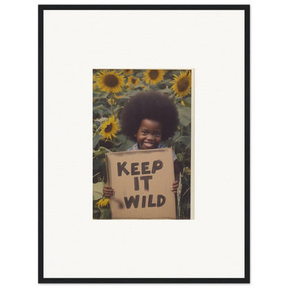 Framed photo of someone with a KEEP IT WILD sign among sunflowers, Visions Bloom Exuberance