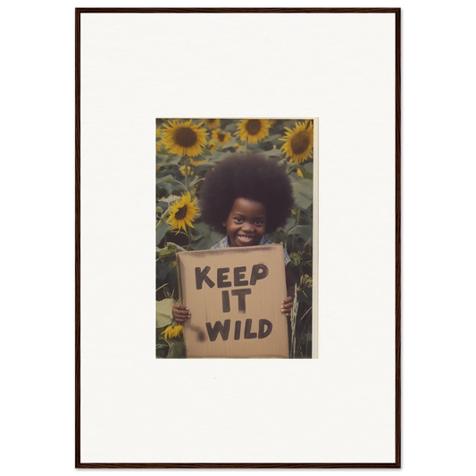 Framed photo of a person with a KEEP IT WILD sign among sunflowers from Visions Bloom Exuberance