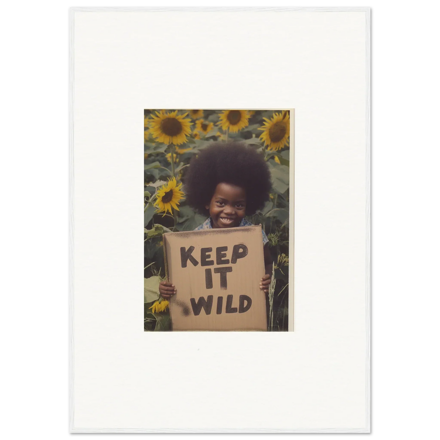 Cardboard sign saying KEEP IT WILD in dark letters from Visions Bloom Exuberance special edition art