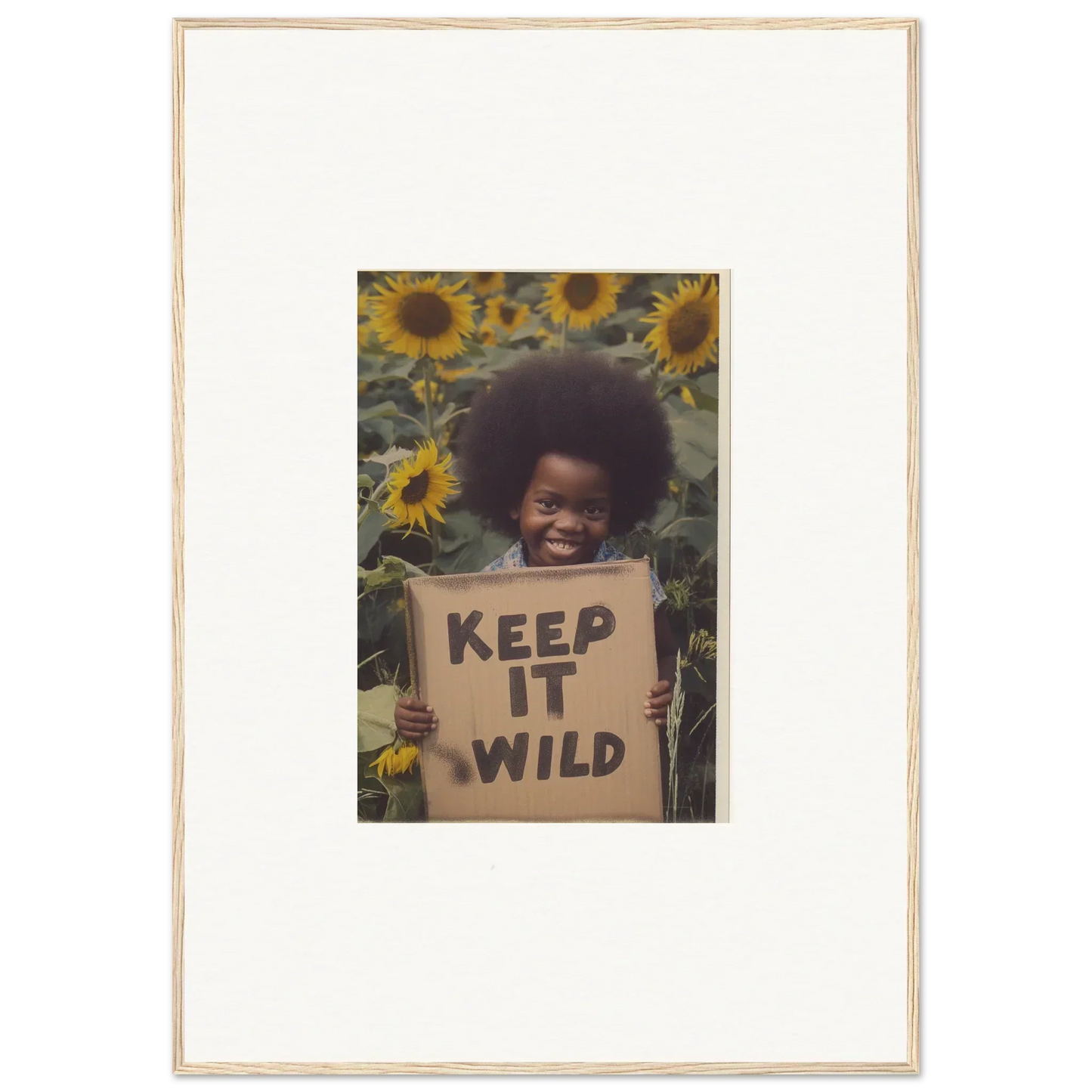 Framed photograph of KEEP IT WILD sign in sunflowers from Visions Bloom Exuberance