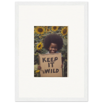 Framed photo of a person holding a KEEP IT WILD sign in sunflowers, Visions Bloom Exuberance