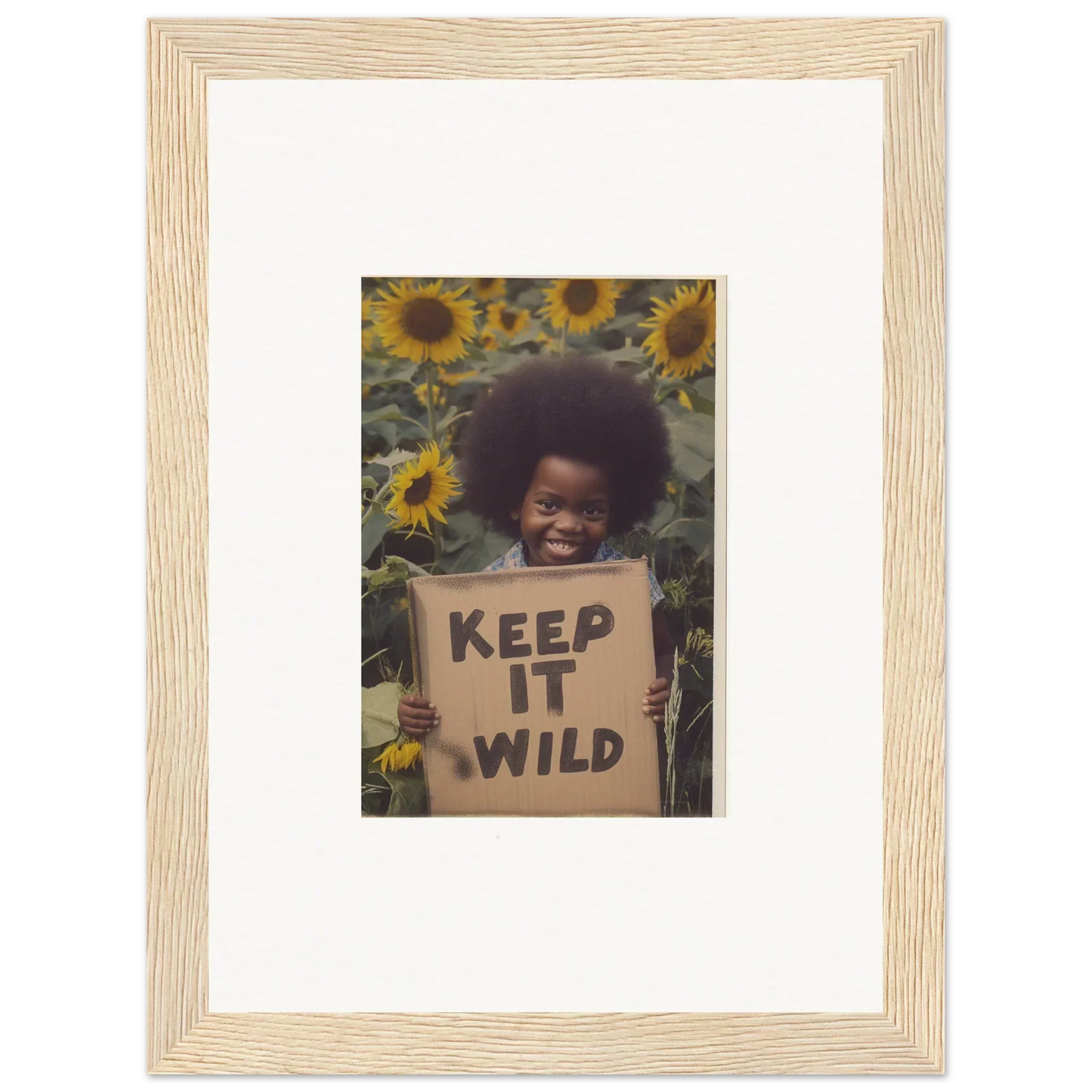 Framed photograph of KEEP IT WILD sign surrounded by sunflowers from Visions Bloom Exuberance