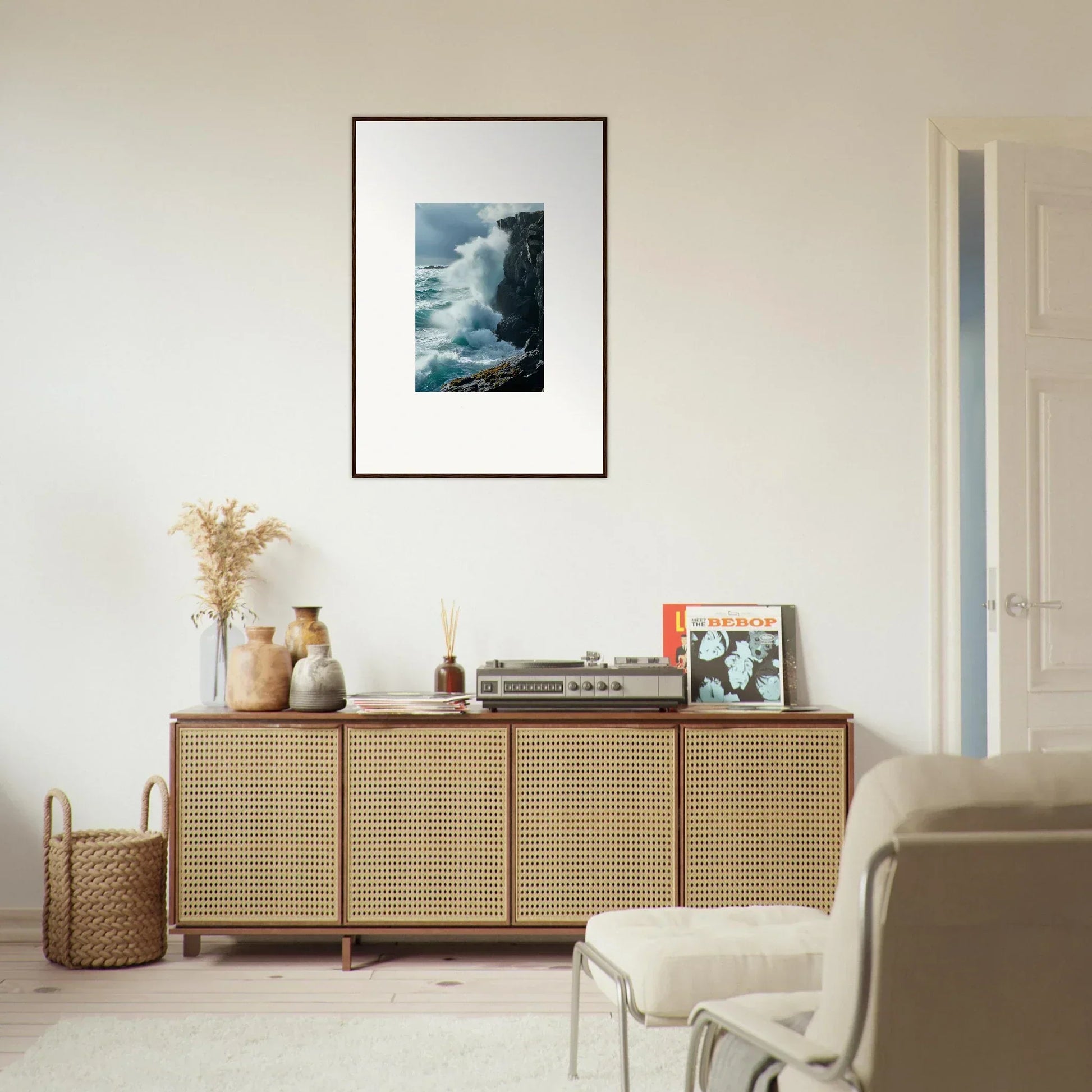 Wooden sideboard with cane-webbed doors and echoed thoughts canvas print on top