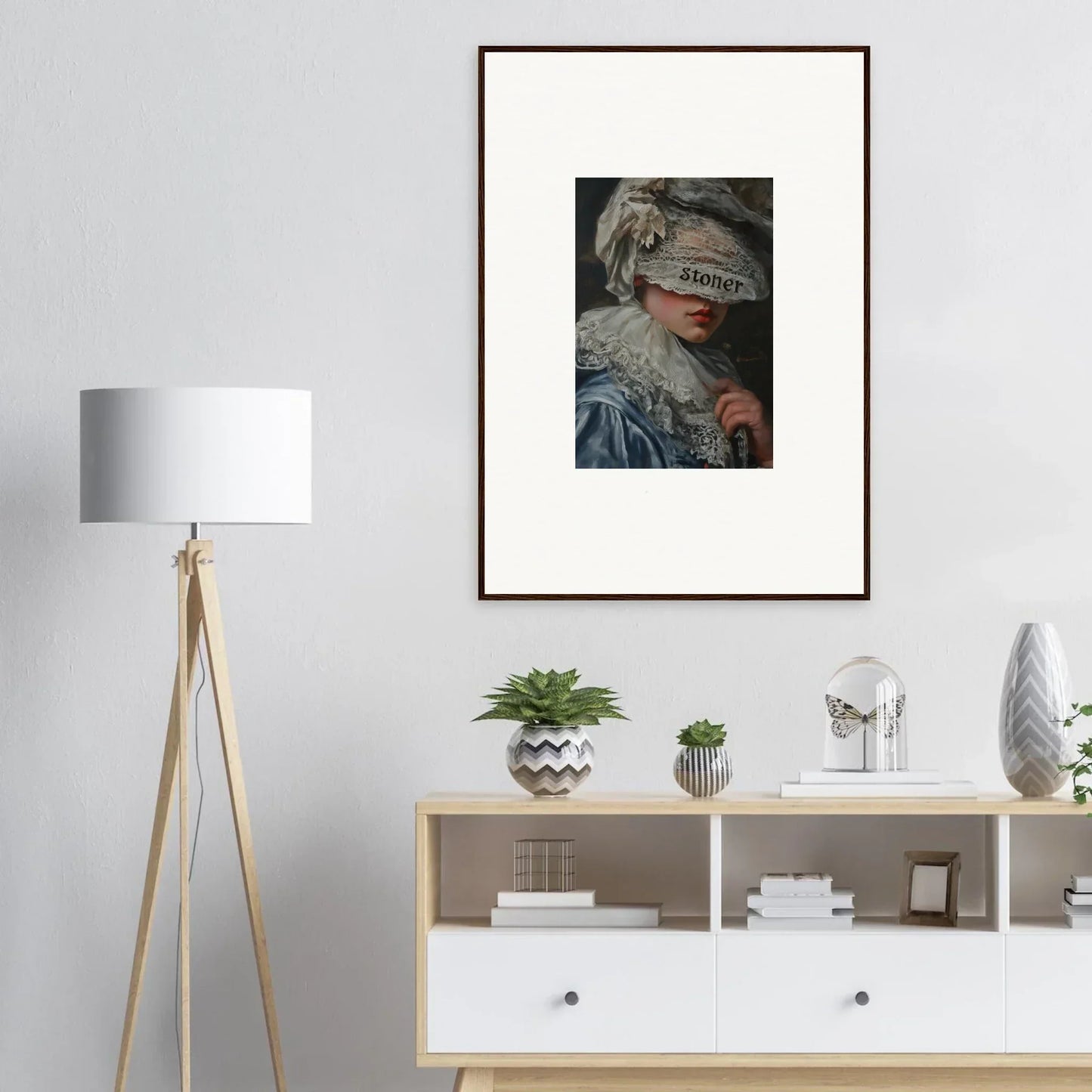 Framed wall art of a figure with obscured eyes, perfect for unique room decoration