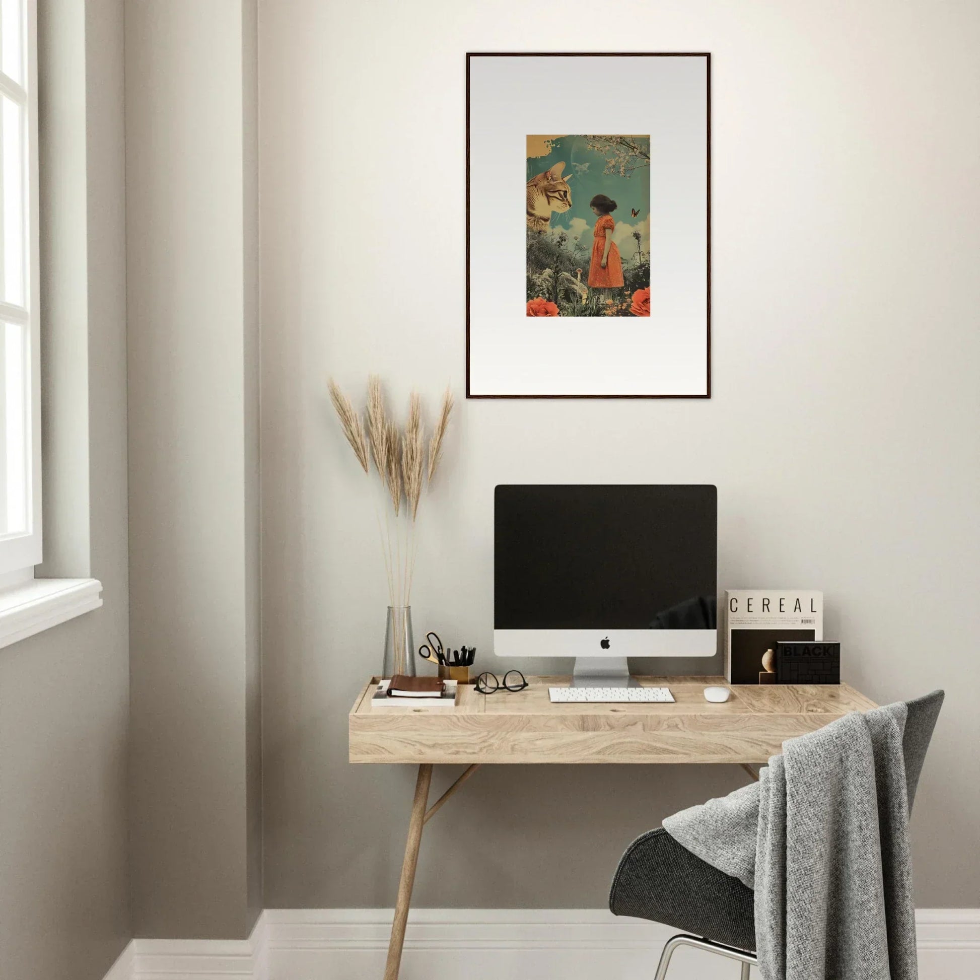 Minimalist wooden desk with a computer and canvas print for a cozy perception vacation