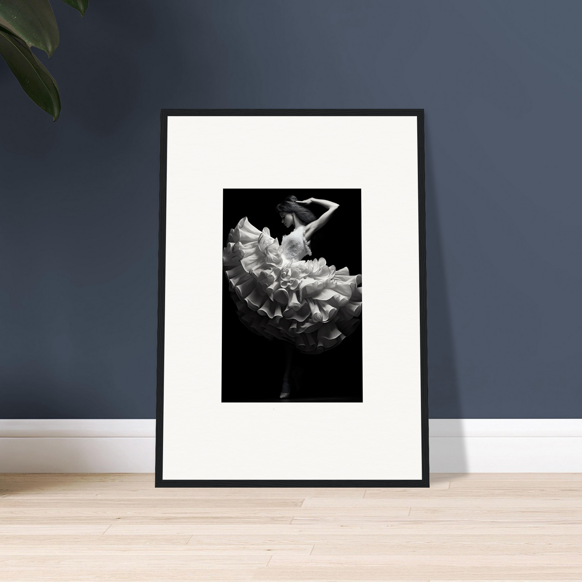 Framed black and white photograph of a dancer in a flowing dress.