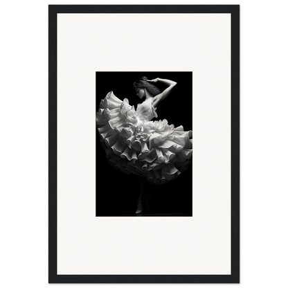 Black and white photograph of a dancer in a flowing, ruffled dress.