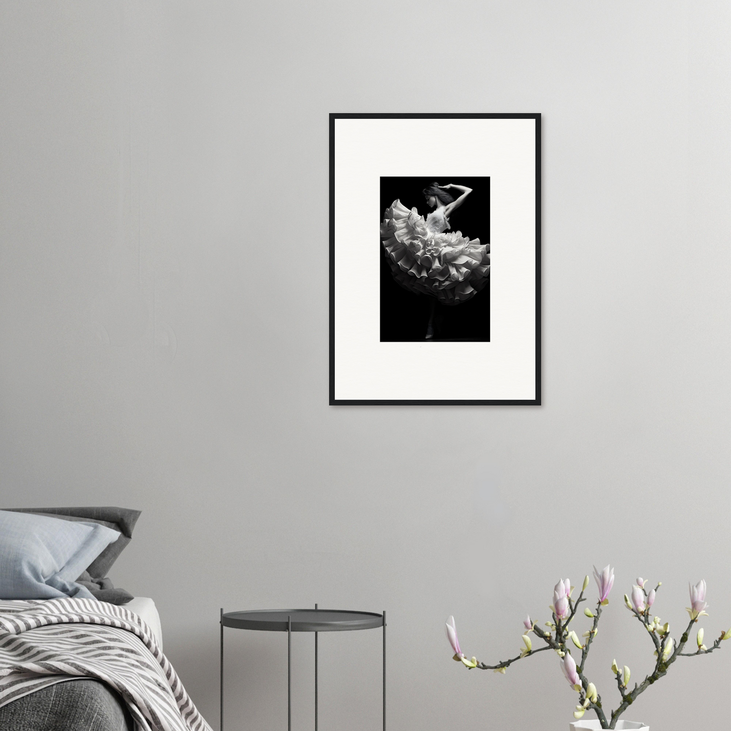 Framed black and white photograph of a dancer in flowing fabric.