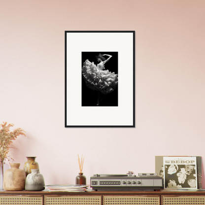 Framed black and white photograph of a dancer in a flowing dress.