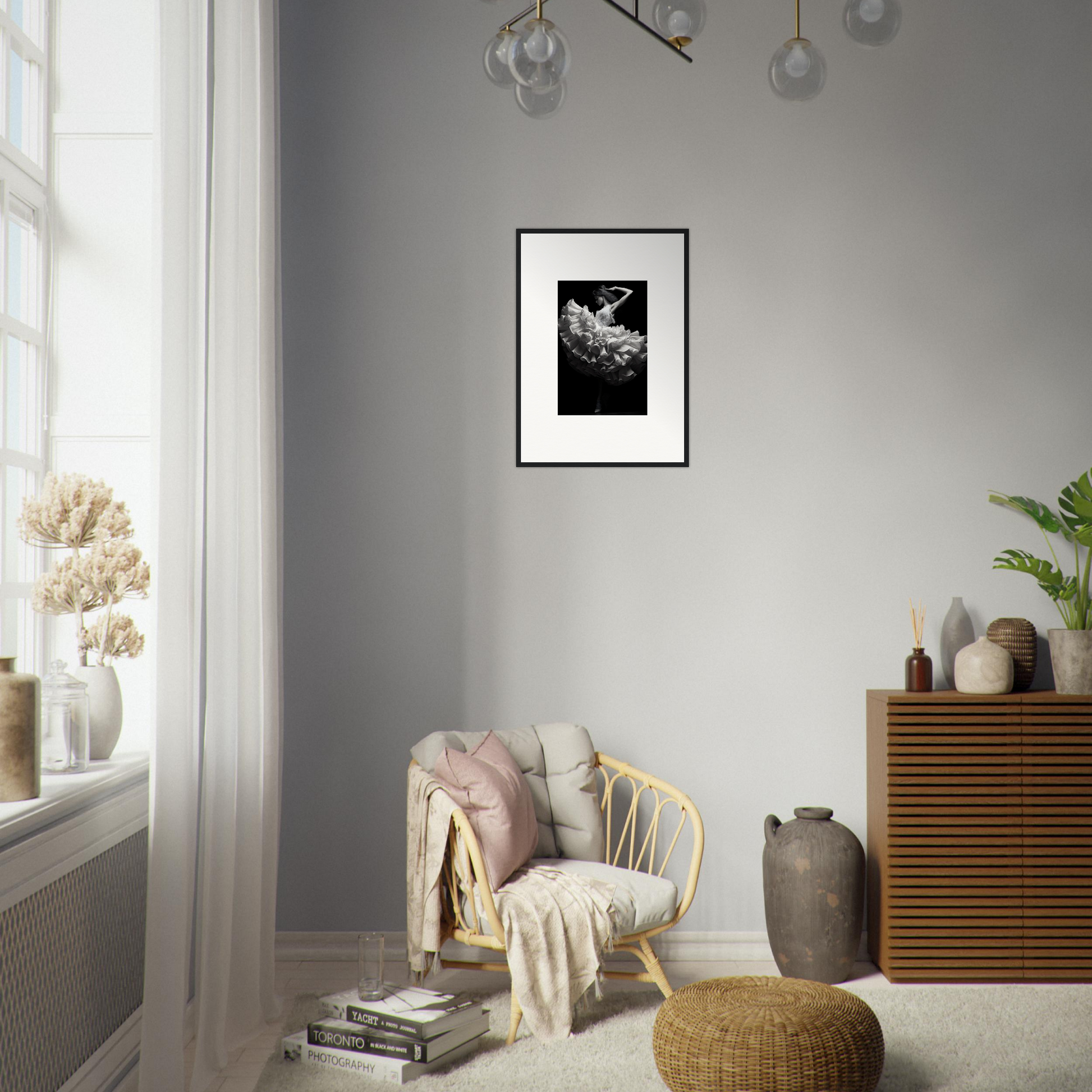 Cozy living room corner with a wicker armchair, framed artwork, and decorative accessories.