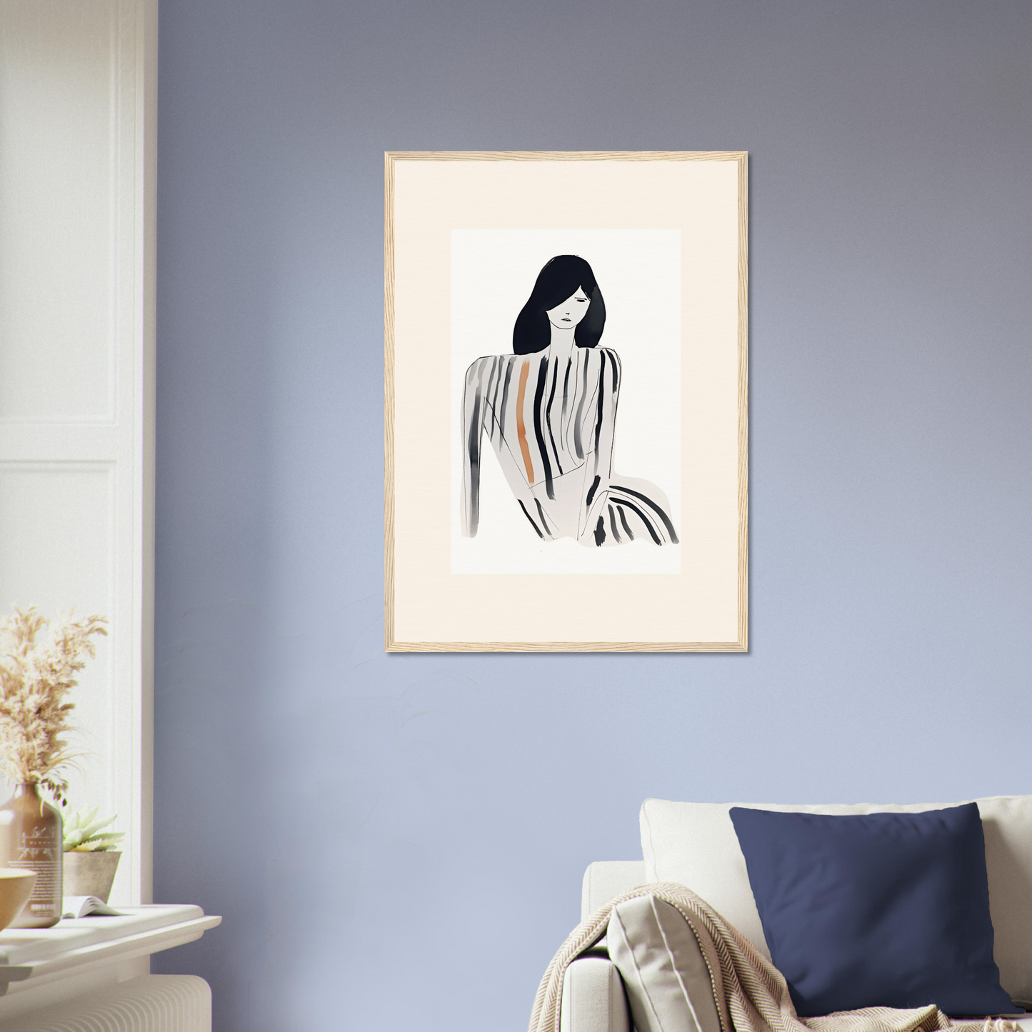 Framed minimalist artwork depicting a stylized female figure with flowing lines.