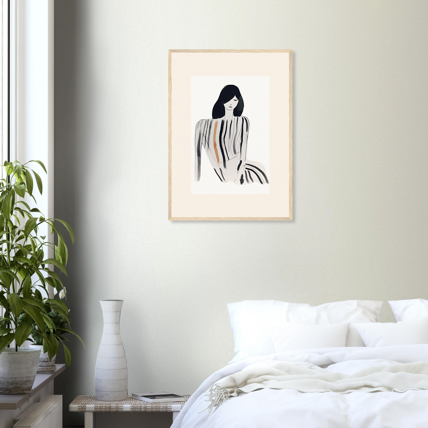 Framed minimalist artwork depicting a stylized female figure with flowing lines.