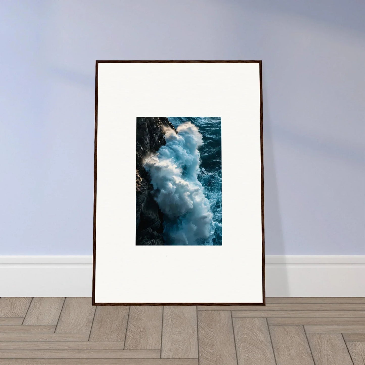 Framed wall art of crashing ocean waves on a rocky cliff, ideal room decor