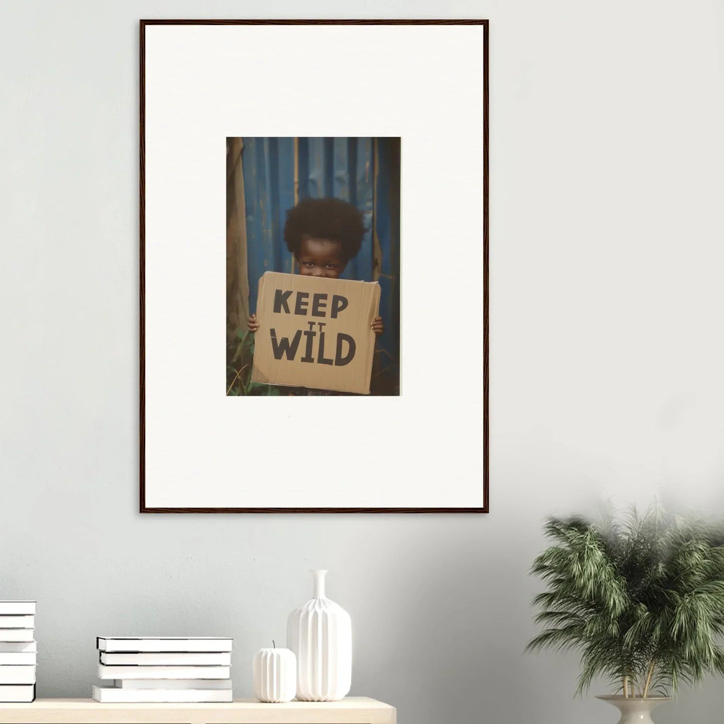 Framed photograph of a person with a KEEP WILD sign for innocent harmony room decoration