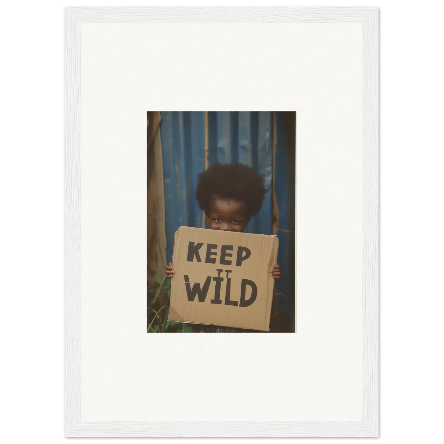 Framed photo of a person with a KEEP IT WILD sign, perfect for innocent harmony room decoration