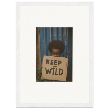 Framed photo of a person with a KEEP IT WILD sign, perfect for innocent harmony room decoration