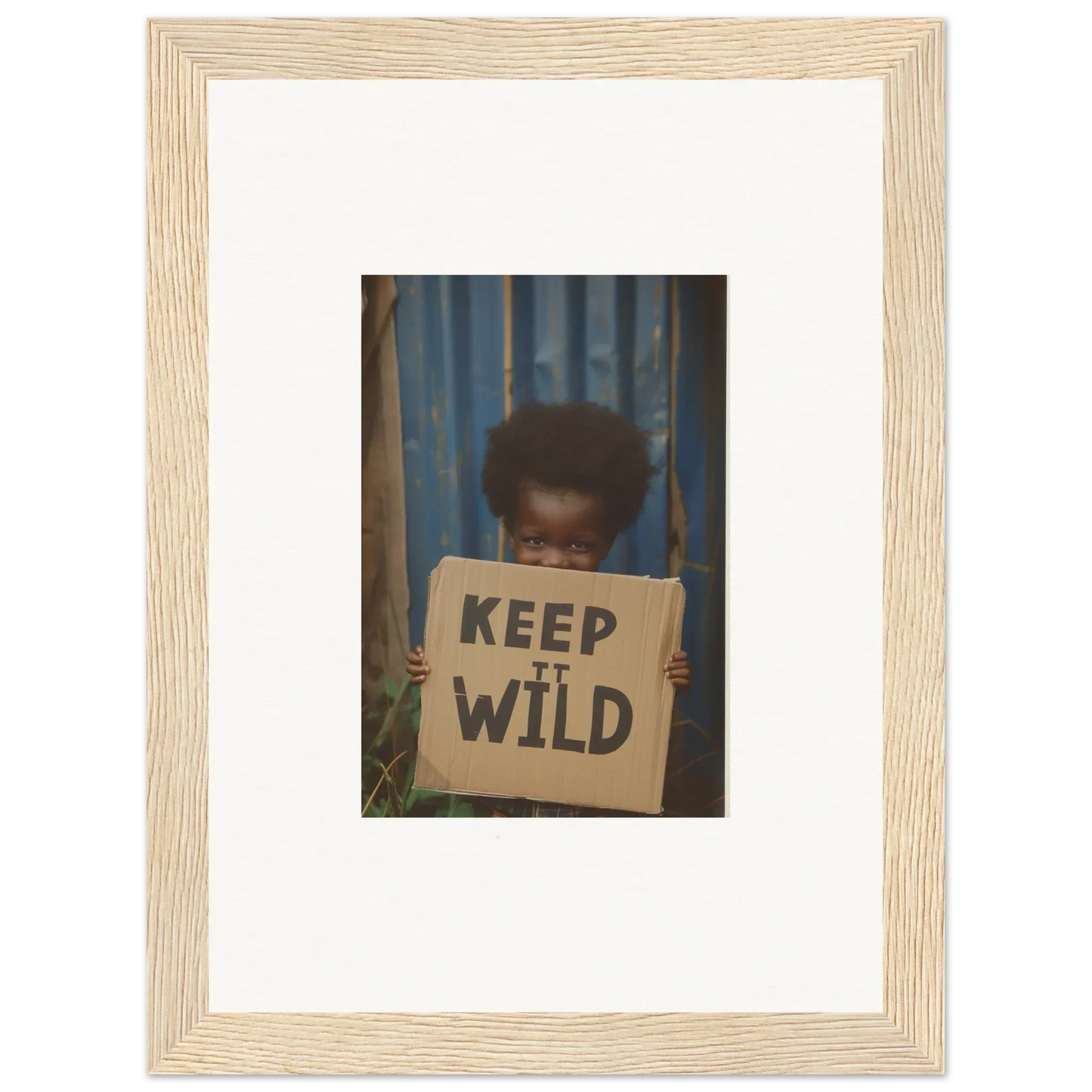 Framed photograph of a person holding a KEEP IT WILD sign for stylish room decoration