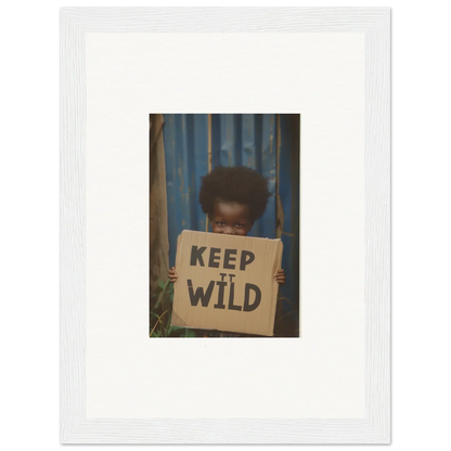 Framed photo of a person with a KEEP IT WILD sign, perfect for room decoration in Innocent Harmony style