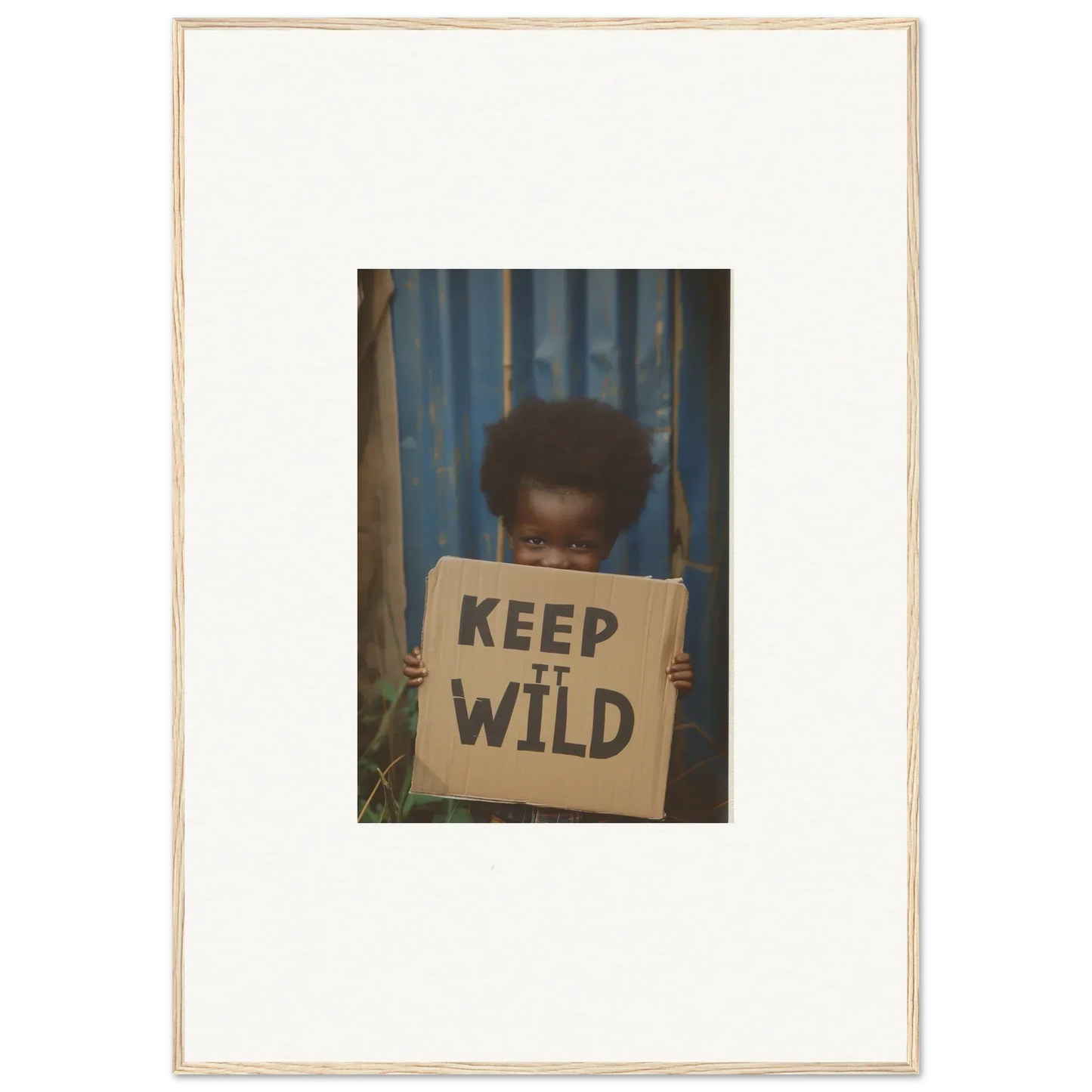 Framed photo of a person with a KEEP IT WILD sign, perfect for innocent harmony room decoration