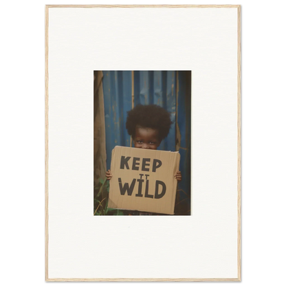 Framed photo of a person with a KEEP IT WILD sign, perfect for innocent harmony room decoration