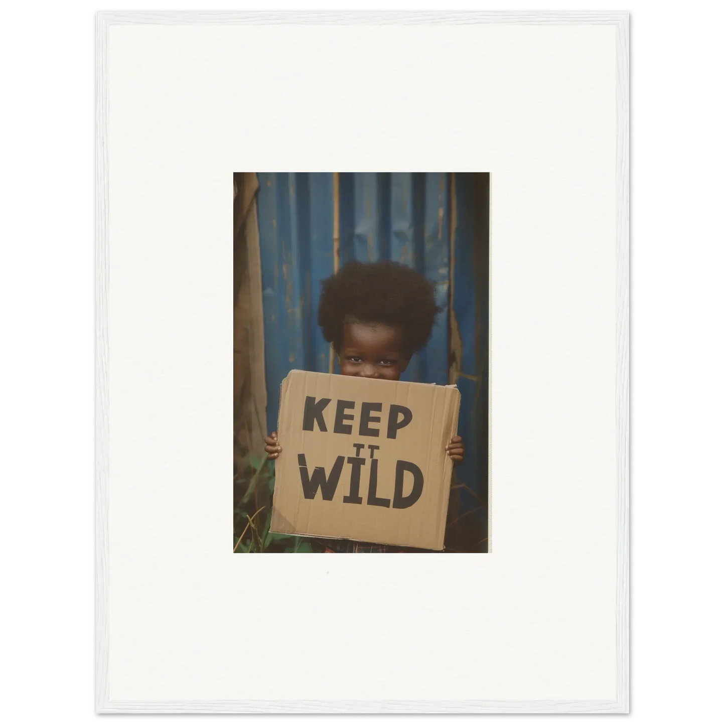 Framed photo of a person with a KEEP IT WILD sign, perfect for room decoration