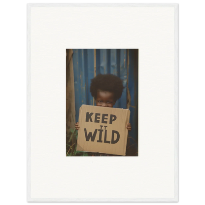 Framed photo of a person with a KEEP IT WILD sign, perfect for room decoration