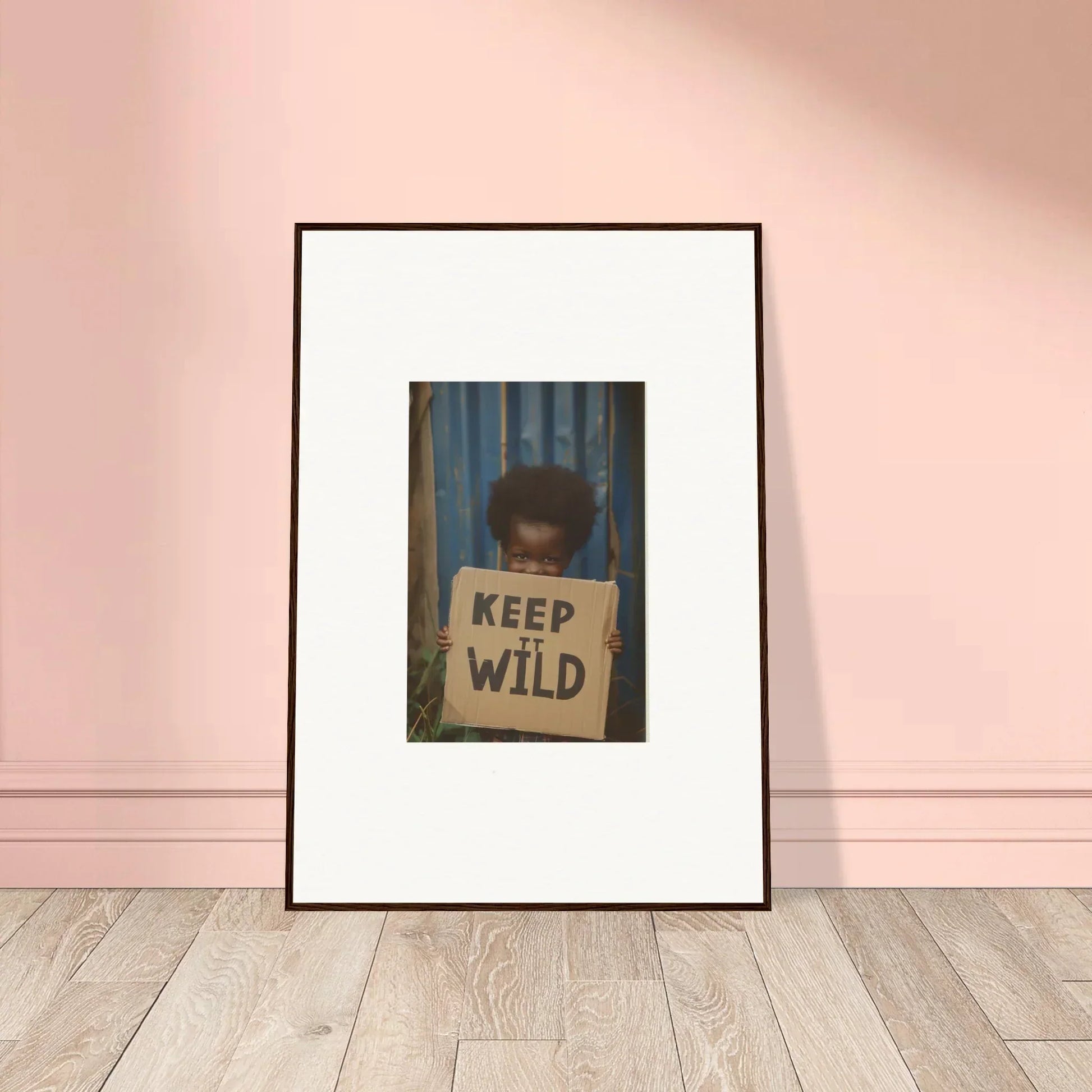 Framed photo of someone with a KEEP WILD sign, perfect for innocent harmony room decoration