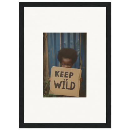 Framed photograph of a person holding a Keep It Wild sign for innocent harmony room decoration