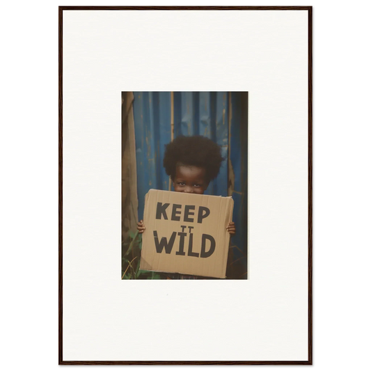 Framed photograph of a person with a KEEP IT WILD sign for room decoration