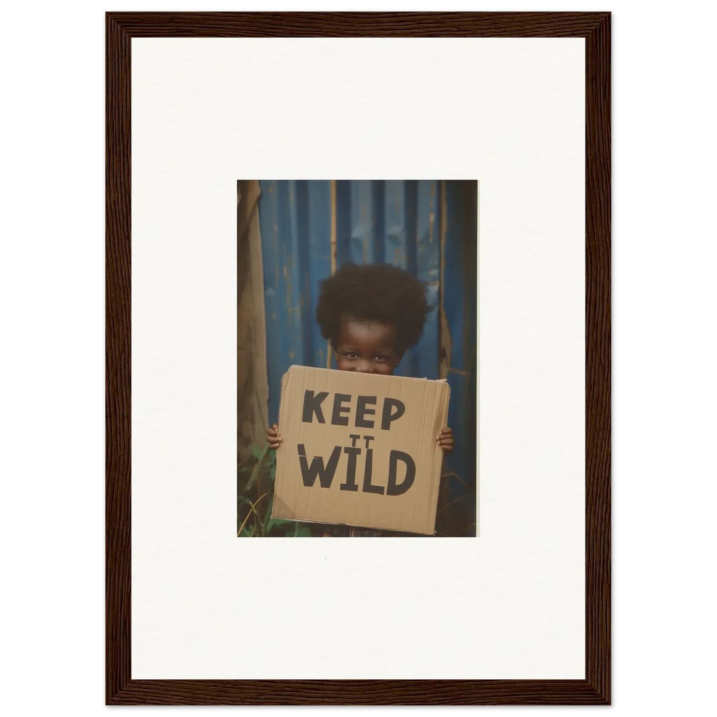 Framed photograph of a person with a KEEP IT WILD sign for room decoration in Innocent Harmony