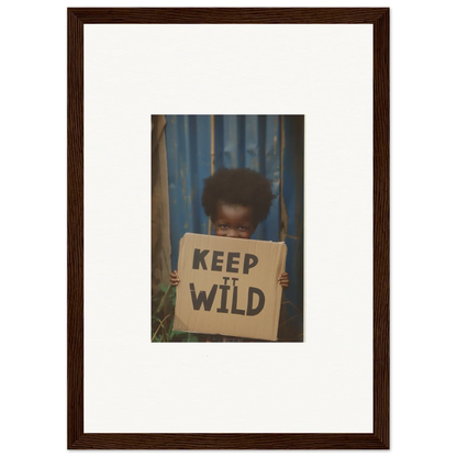 Framed photograph of a person with a KEEP IT WILD sign for room decoration in Innocent Harmony