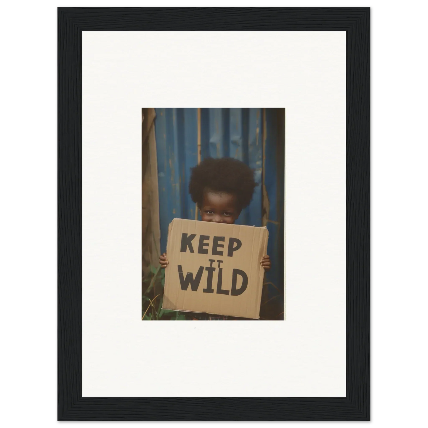 Framed photo of a person with a KEEP IT WILD sign, perfect for innocent harmony room decoration