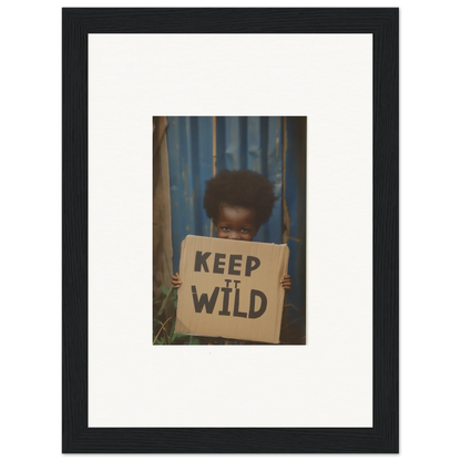 Framed photo of a person with a KEEP IT WILD sign, perfect for innocent harmony room decoration