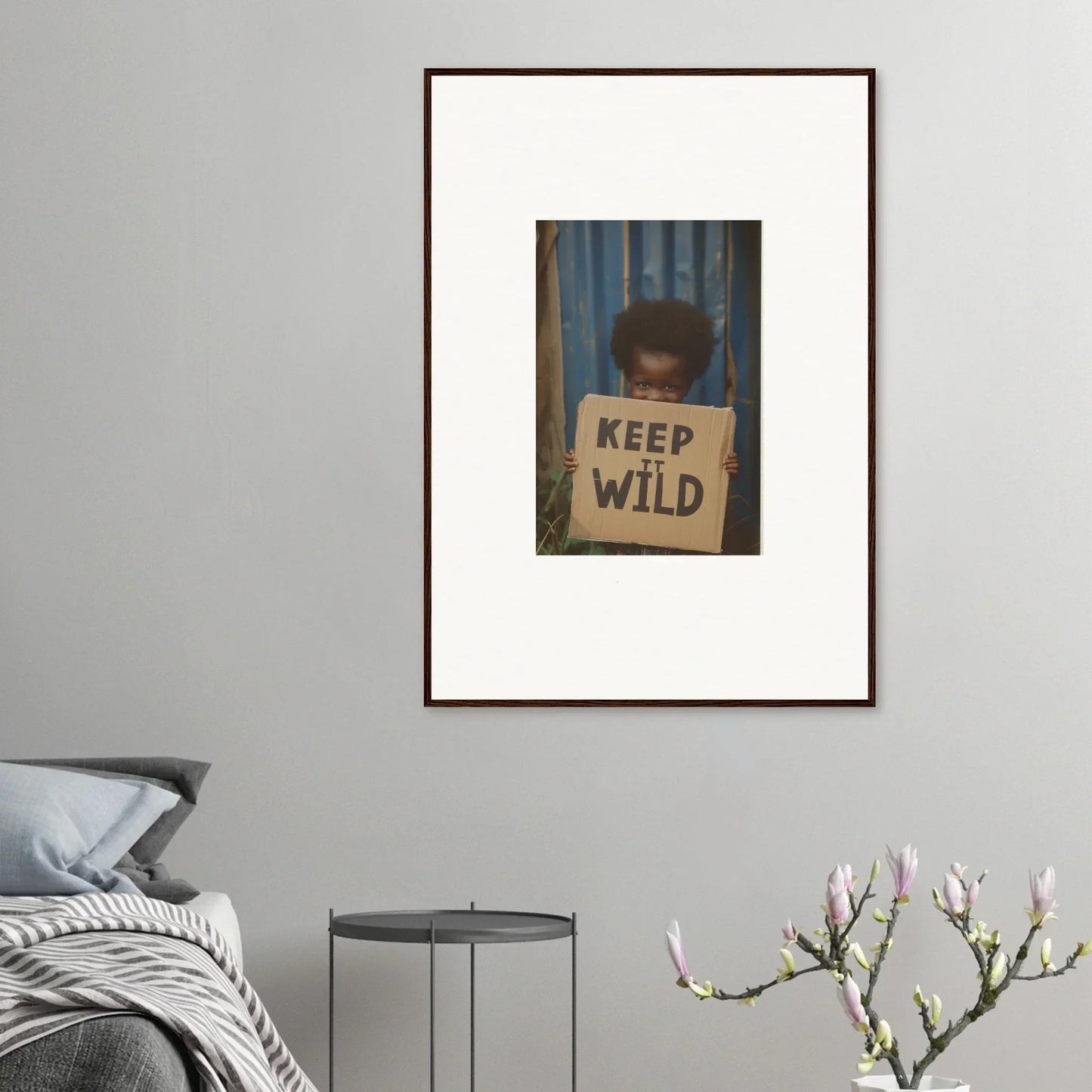 Framed photograph of a person with a KEEP WILD sign for cool room decoration